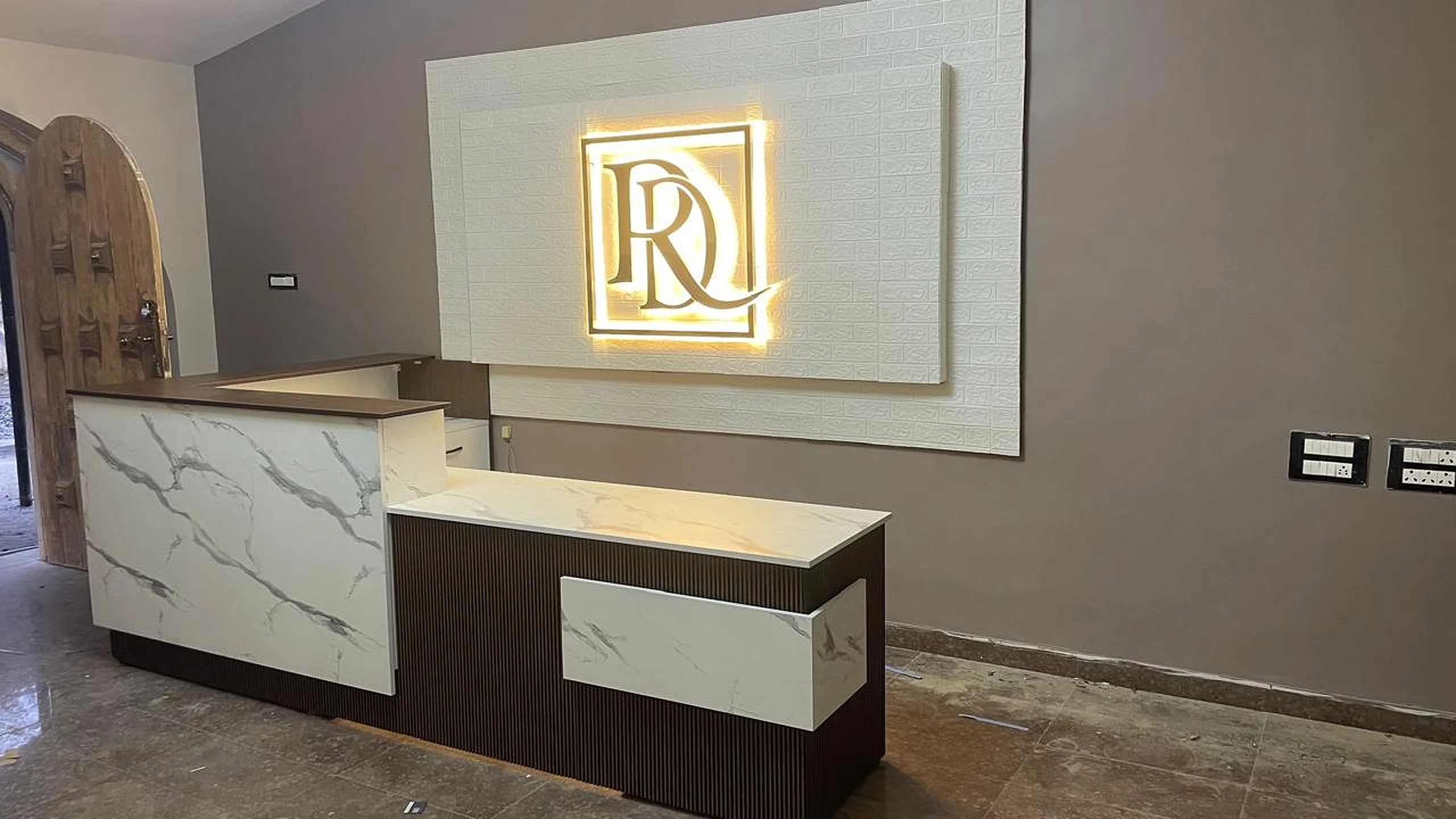 Backlit acrylic logo sign for hotel reception